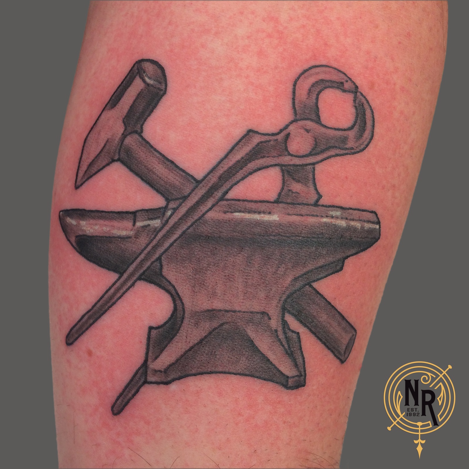 Blacksmith anvil and tools tattoo